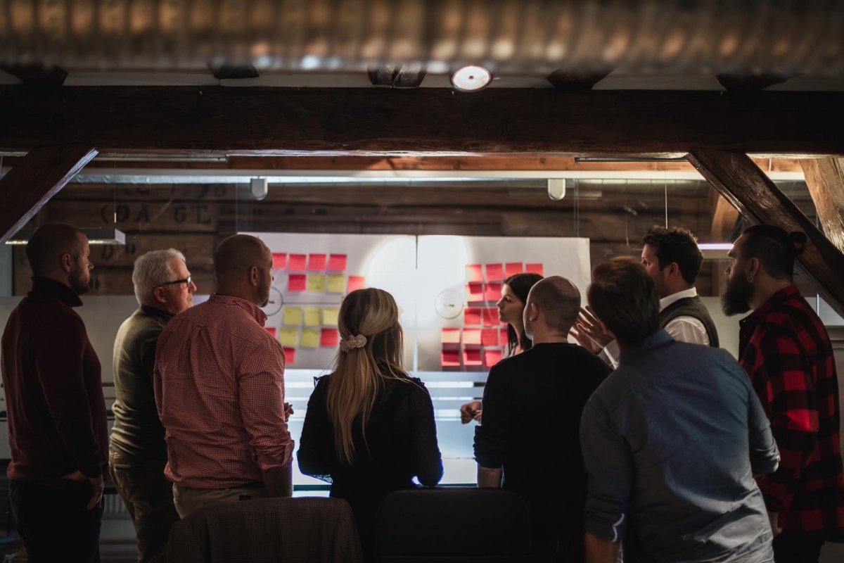 People around board in Web Design Strategy Meeting
