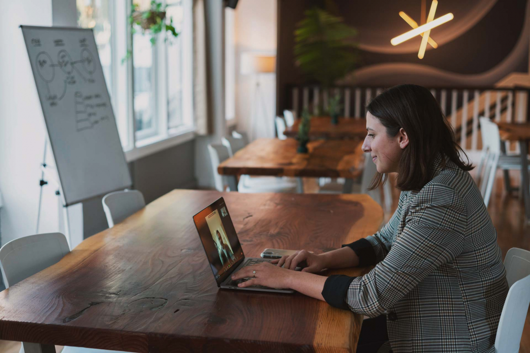 Woman at desk with laptop